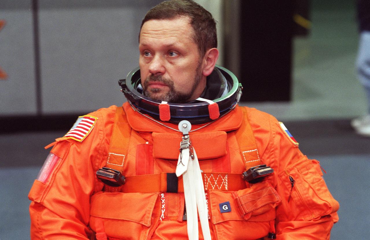 S99-14210 (15 November 1999) --- Cosmonaut Boris V. Morukov, mission specialist representing the Russian Space Agency (RSA), listens attentively to a briefing which covered emergency bailout procedures. Out of frame are six crew mates who joined Morukov for the emergency bailout training.