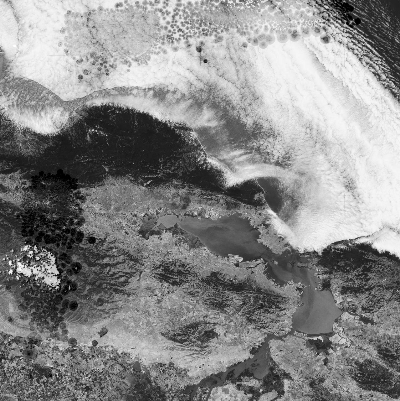 SL2-05-102 (June 1973) --- A black and white photograph of the San Francisco Bay California area, taken from the Skylab 1-2 space station cluster in Earth orbit. THE PICTURE SHOULD BE HELD WITH THE CLOUDS AND PACIFIC OCEAN ON THE LEFT. This photograph was taken by one of six lenses of the Itek-furnished S190-A Multispectral Photographic Facility Experiment in the Multiple Docking Adapter of the space station. Note the thickly populated and highly developed area around the Bay. Among the cities visible in this photograph are San Francisco, Oakland, Berkeley and San Jose.  This view extends eastward to show a portion of the San Joaquin Valley. The S190-A experiment is part of the Skylab Earth Resources Experiments Package (EREP). Type SO-022 film was used. This station covered the spectral region from 0.6 to .07 micrometers. Photo credit: NASA