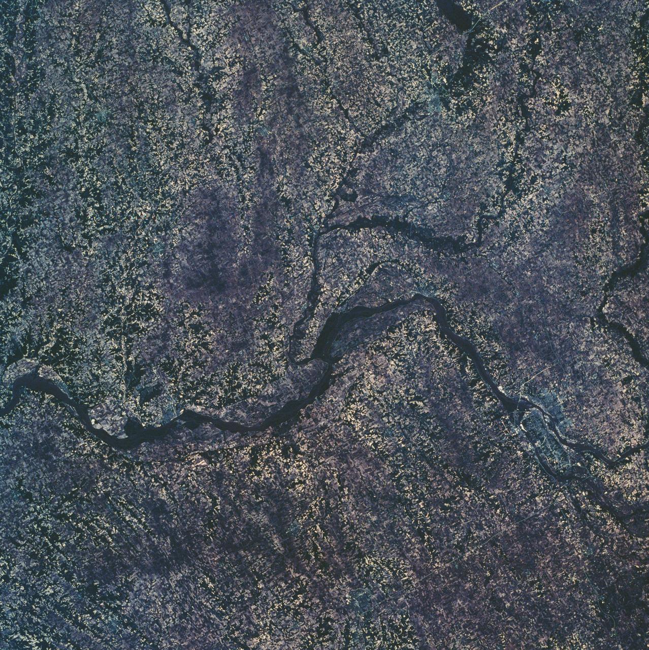 SL2-10-250 (May-June 1973) --- A vertical view of eastern Iowa and northwestern Illinois, as photographed from Skylab space station in Earth orbit. Davenport, Burlington and Muscatine, Iowa; and Rock Island and Moline, Illinois can be delineated on opposite sides of the Mississippi River. The Iowa River and tributaries of it can also be delineated.  This photograph was taken with one of six lenses of the Itek-furnished Multispectral Photographic Facility Experiment S190-A mounted in the Multiple Docking Adapter (MDA) of the space station. A six-inch lens, using 70mm medium speed Ektachrome (SO-356) film, was used. Agencies participating with NASA on the EREP project are the Departments of Agriculture, Commerce and Interior; the Environmental Protection Agency and the Corps of Engineers. All EREP photography is available to the public through the Department of Interior's Earth Resources Observations Systems Data Center, Sioux Falls, South Dakota, 57198. Photo credit: NASA