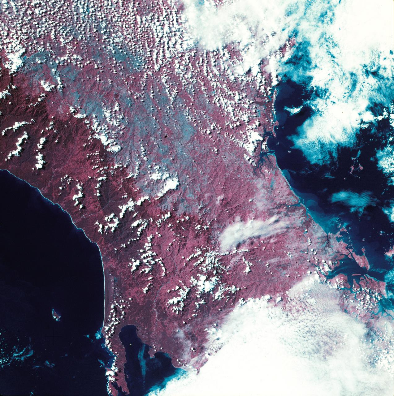 SL3-27-224 (July-September 1973) --- A vertical view of the western portion of the Republic of Panama on the Isthmus of Panama as photographed from Earth orbit by one of the six lenses of the Itek-furnished S190-A Multispectral Photographic Facility Experiment aboard the Skylab space station. This picture was taken with 2443 infrared color film.  The large, clear body of water on the north side of the isthmus is Golfo de los Mosquitos, an extension of the Caribbean Sea. The large, partly cloud-covered body of water on the south side of the isthmus is Golfo de Chiriqui, an extension of the Pacific Ocean.  Federal agencies participating with NASA on the EREP project are the Department of Agriculture, Commerce, Interior, the Environmental Protection Agency and the Corps of Engineers. All EREP photography is available to the public through the Department of Interior?s Earth Resources Observation Systems Data Center, Sioux Falls, South Dakota, 57198. Photo credit: NASA