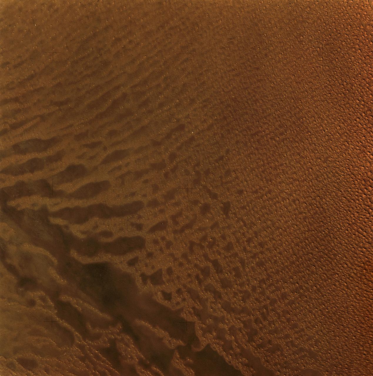 SL3-34-056 (July-September 1973) --- A near vertical view of an 8,000 square-mile area of the Grand Erg Oriental in east central Algeria as photographed from Earth orbit by one of the six lenses of the Itek-furnished S190-A Multispectral Photographic Facility Experiment in the Multiple Docking Adapter of the Skylab space station. The Grand Erg contains vast areas of sand dunes and sand plains. This photograph illustrates the variety of surface features that are characteristic of the Sahara Desert. The dark areas are relatively sand free, and may contain rock outcrops along which travel is considerably easier. Sand dunes are abundant in this picture, and their size, shape, location and pattern are due to the underlying topography and direction of the prevailing winds. Scientists interested in study of dune fields will be able to use this photograph for detailed analysis of the dune features, especially their characteristics adjacent to the sand-free areas. Federal agencies participating with NASA on the EREP project are the Departments of Agriculture, Commerce, Interior, the Environmental Protection Agency and the Corps of Engineers.  All EREP photography is available to the public through the Department of Interior?s Earth Resources Observations Systems Data Center, Sioux Falls, South Dakota, 57198. Photo credit: NASA