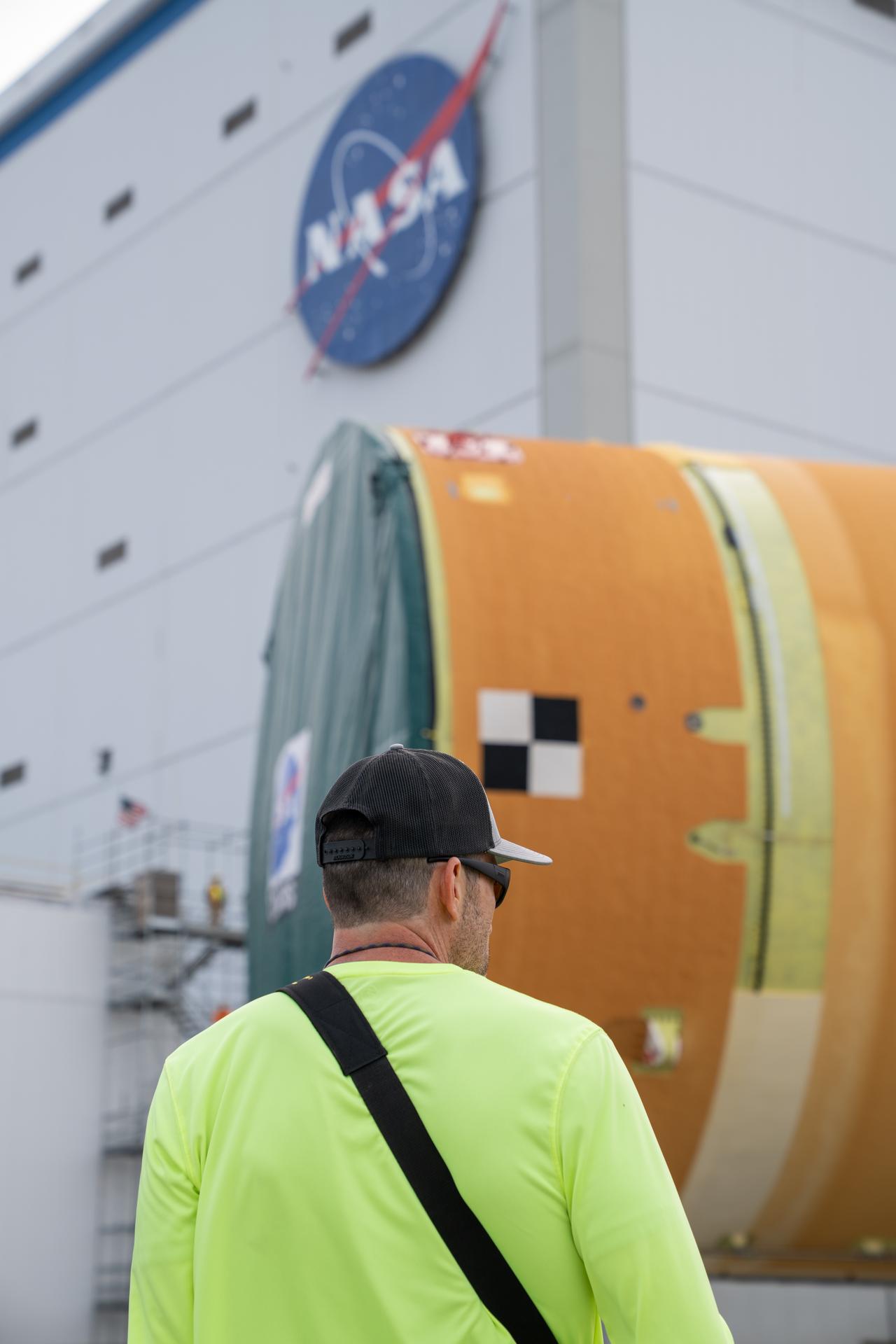 NASA moved the core stage, or the largest section, of the SLS (Space Launch System) rocket that will launch the crewed Artemis III mission in 2027 from the agency’s Michoud Assembly Facility to the agency’s Pegasus barge in New Orleans on April 20. The barge will ferry the top four-fifths – the section containing the liquid hydrogen tank, liquid oxygen tank, intertank, and forward skirt – of the SLS core stage to NASA’s Kennedy Space Center in Florida to complete outfitting and vertical integration.  Teams with NASA and Boeing, the SLS core stage lead contractor, used specialized transporters to guide the top four-fifths from the NASA rocket factory to Pegasus. Prior to the move, technicians added an engine section transportation simulator to the rocket stage for shipment to the Space Coast.  Next year’s Artemis III mission will launch astronauts to Earth’s orbit aboard the Orion spacecraft on top of SLS to test rendezvous and docking capabilities between Orion and commercial spacecraft needed to land Artemis IV astronauts on the Moon in 2028. NASA’s SLS is the only rocket capable of sending Orion, astronauts, and supplies to the Moon in a single launch.   Photo Credit: (NASA/Brandon Hancock) 