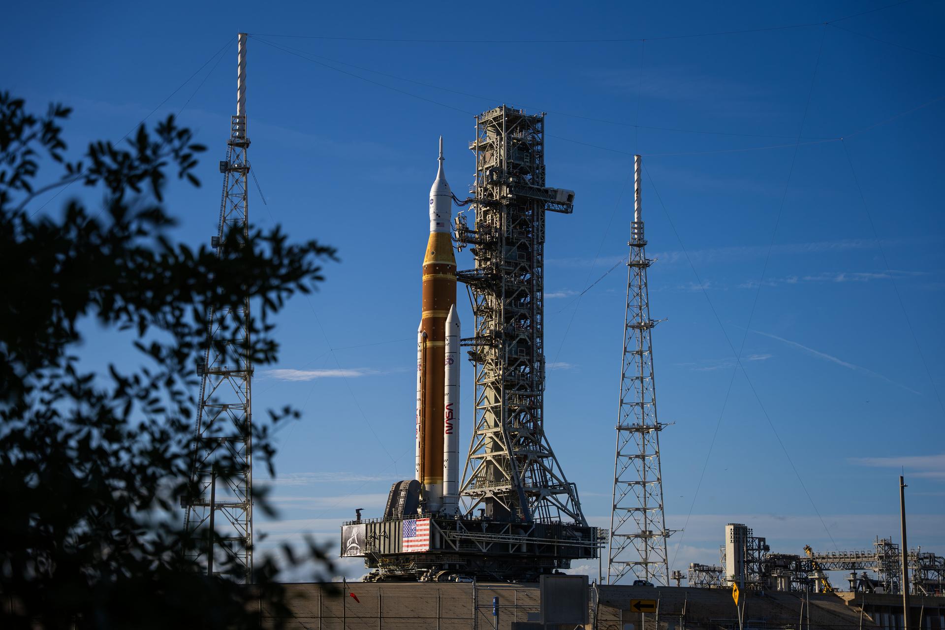 This image shows NASA’s SLS (Space Launch System) and Orion spacecraft rolling out of the Vehicle Assembly Building at NASA’s Kennedy Space Center. NASA's massive Crawler-Transporter, upgraded for the Artemis program, carries the powerful SLS rocket and Orion spacecraft on the Mobile Launcher from the Vehicle Assembly Building to Launch Pad 39B at Kennedy Space Center in preparation for the Artemis II mission.