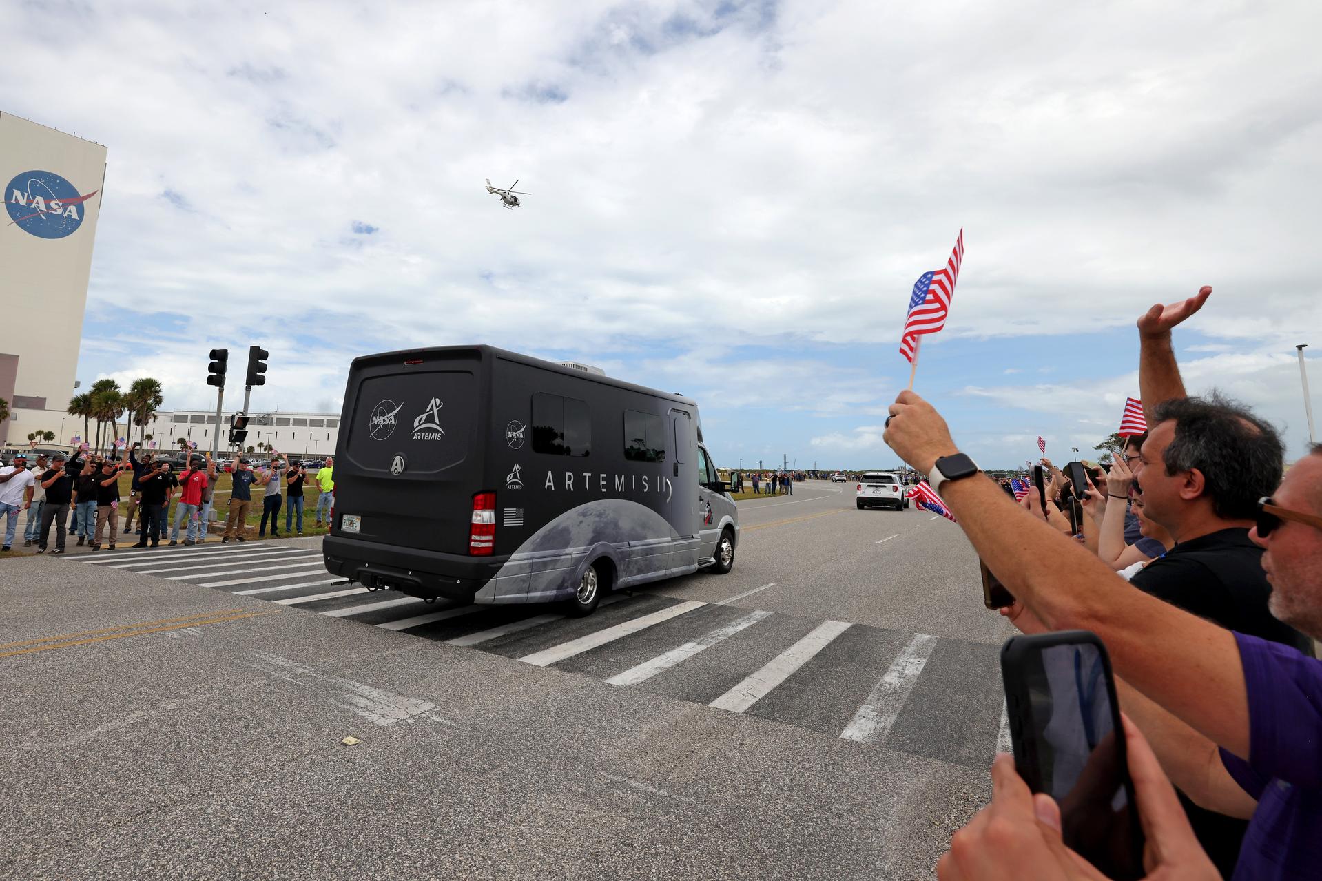 The Artemis II astronauts are cheered by the crowd on Saturn Causeway as they make their way to the SLS (Space Launch System) rocket at Launch Complex 39B on April 1, 2026, at NASA’s Kennedy Space Center in Florida. Artemis II is the first crewed mission of the agency’s Artemis campaign. The mission will send NASA astronauts Reid Wiseman, Victor Glover, and Christina Koch and CSA (Canadian Space Agency) astronaut Jeremy Hansen on an approximately 10-day journey around the Moon and back to Earth. Image credit: NASA/Michael DeMocker