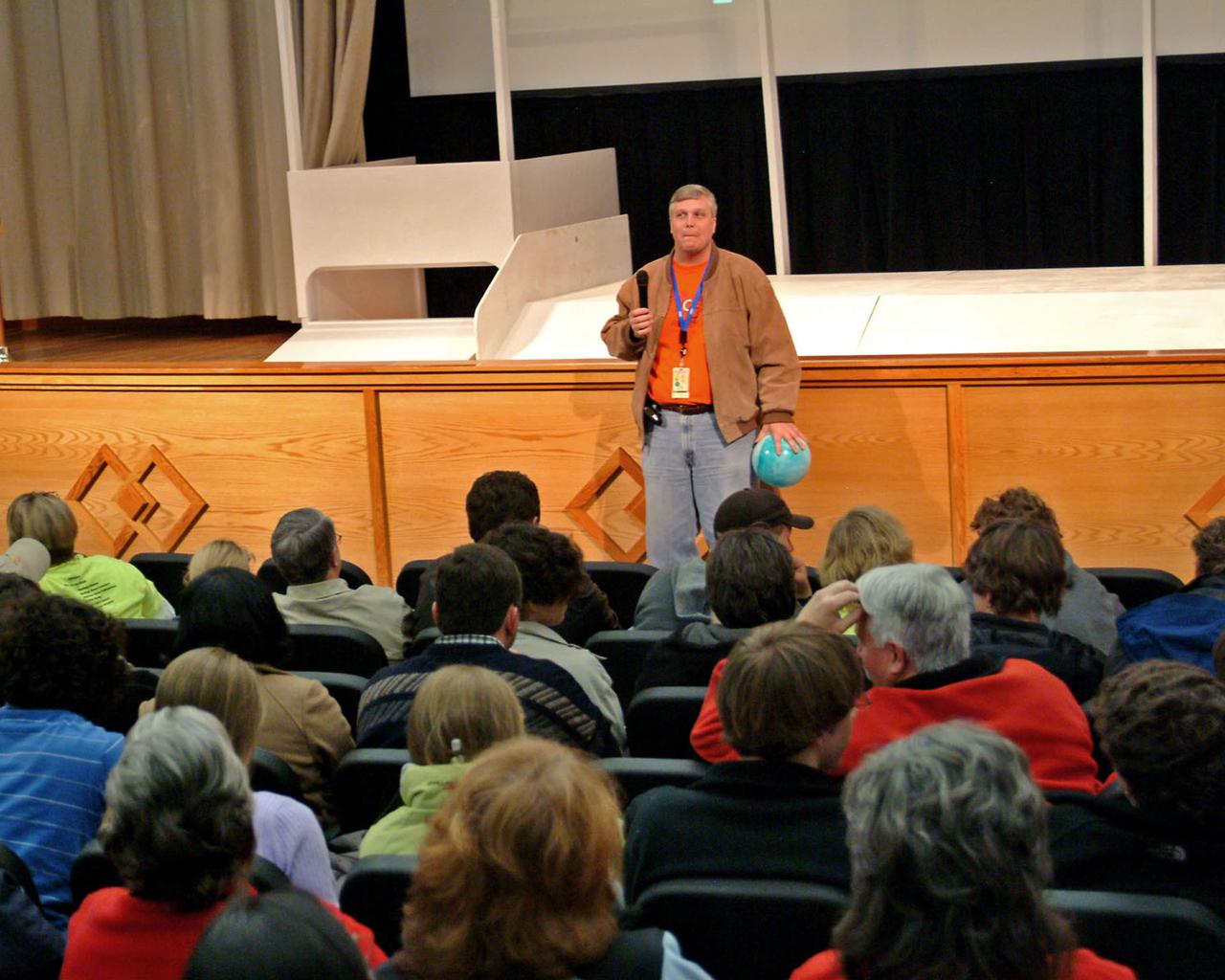 Bo Clarke, mentor for Gulfport High School's Team Fusion, offers strategy tips to students and coaches during the FIRST Robotics Competition kickoff held at StenniSphere on Jan. 7. Clarke is the lead building and infrastructure specialist for NASA's Shared Services Center at Stennis Space Center.