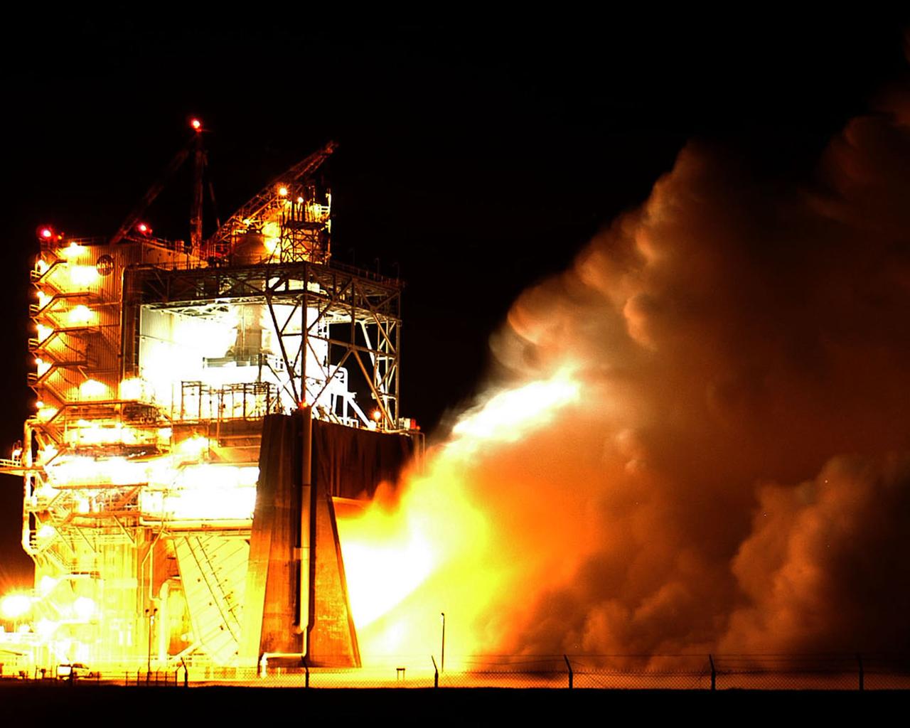 Water vapor surges from the flame deflector of the A-2 Test Stand at NASA's Stennis Space Center on Jan. 9 during the first space shuttle main engine test of the year. The test was an engine acceptance test of flight engine 2058. It's the first space shuttle main engine to be completely assembled at Kennedy Space Center. Objectives also included first-time (green run) tests of a high-pressure oxidizer turbo pump and an Advanced Health System Monitor engine controller. The test ran for the planned duration of 520 seconds.