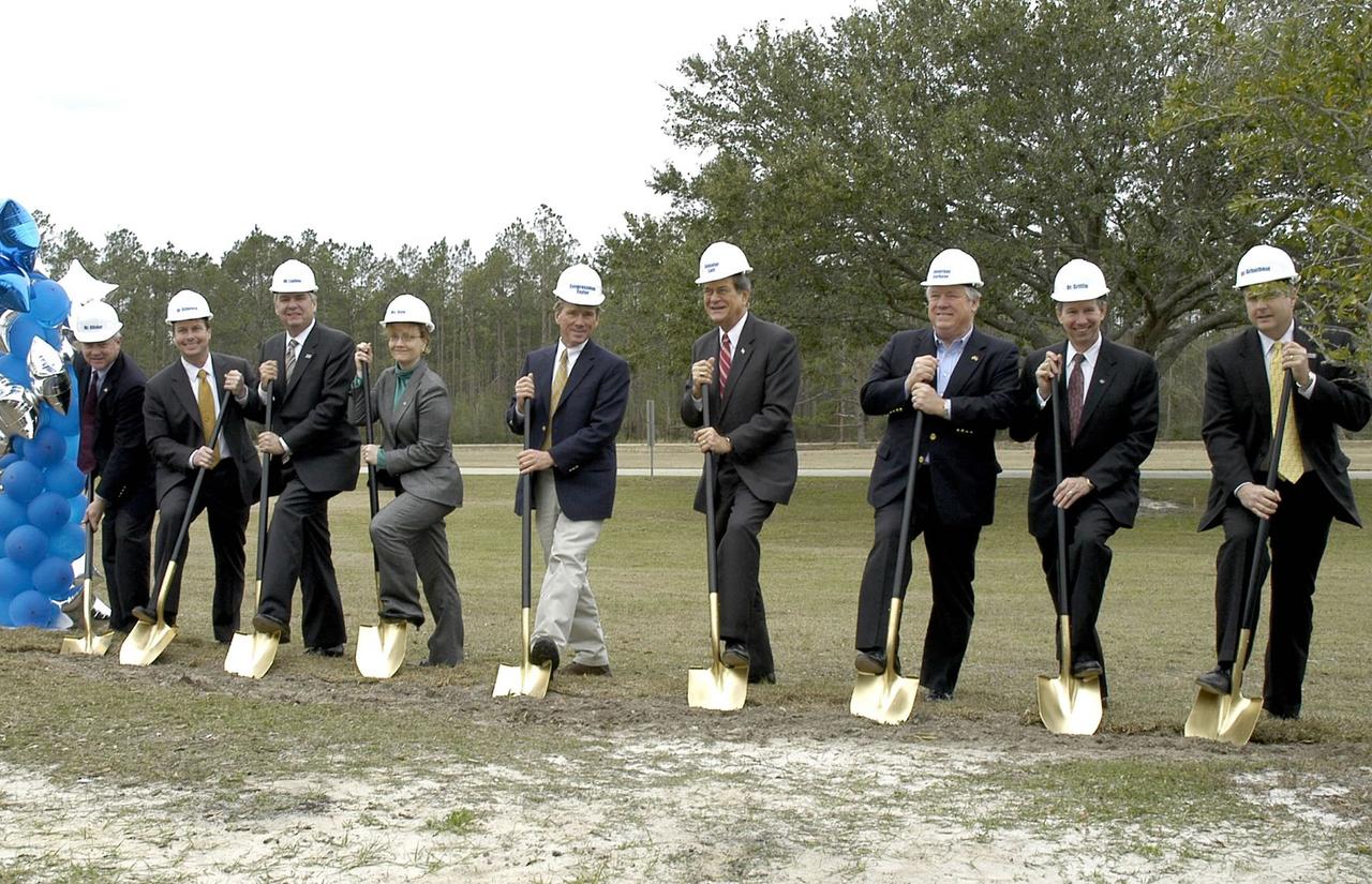 NASA officials and elected leaders were on hand for the groundbreaking ceremony of the NASA Shared Services Center Feb. 24, 2006, on the grounds of Stennis Space Center. The NSSC provides agency centralized administrative processing, human resources, procurement and financial services. From left, Louisiana Economic Development Secretary Mike Olivier, Stennis Space Center Director Rick Gilbrech, Computer Sciences Corp. President Michael Laphen, NASA Deputy Administrator Shana Dale, Rep. Gene Taylor, Sen. Trent Lott, Mississippi Gov. Haley Barbour, NASA Administrator Mike Griffin and Shared Services Center Executive Director Arbuthnot use golden shovels to break ground at the site.