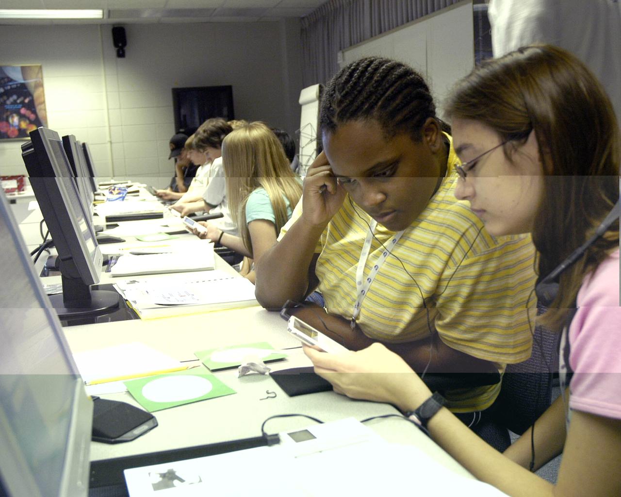 Stennis Space Center's new Astro Camp Plus camp kicked off June 19 for teens ages 13-15. The new camp delves more deeply into the science, math and technology concepts introduced in the center's popular Astro Camp series. Campers including Jasmyne White (left) and Dana Yingst, both of Slidell, La., learn how NASA uses 'podcasting' to broadcast video, and made their own podcasts.