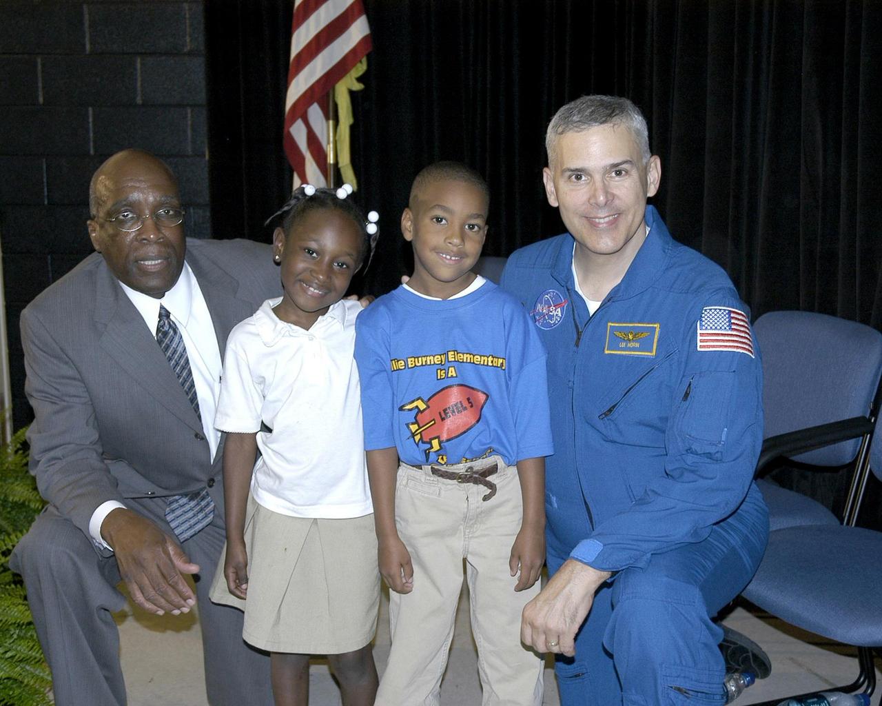 Mississippi Rep. Percy Watson (left) talks with first-graders Savannah Jones and Levi Meyers, and Astronaut Lee Morin on Sept. 8 during the NASA Explorer School kickoff event at the Lillie Burney Elementary School in Hattiesburg, Miss. NASA Explorer Schools help promote student achievement in mathematics and science through activities using the excitement of NASA research, discoveries and missions.
