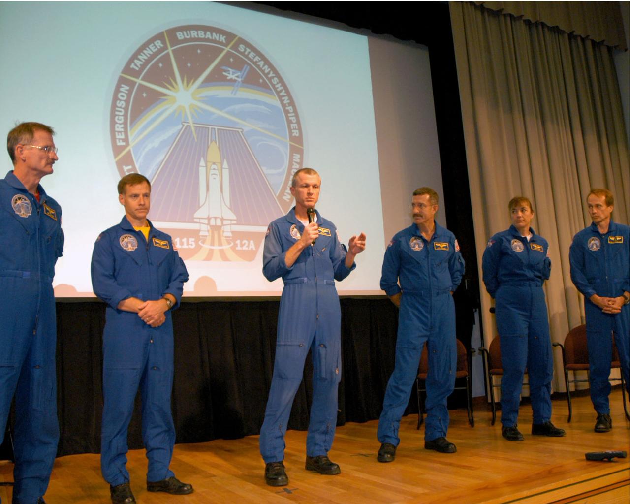 Commander Brent Jett (center) talks with employees and visitors at NASA Stennis Space Center. The astronauts of NASA's STS-115 space shuttle mission visited SSC in south Mississippi to share highlights of their 12-day mission and to thank SSC employees for the reliability of the space shuttle's main engines, which helped propel Space Shuttle Atlantis into orbit. STS-115's other crewmembers are (from left) Mission Specialists Joe Tanner, Dan Burbank, Heidemarie Stefanyshyn-Piper and Steve MacLean of the Canadian Space Agency. The mission launched Sept. 9, 2006, resuming construction of the International Space Station.