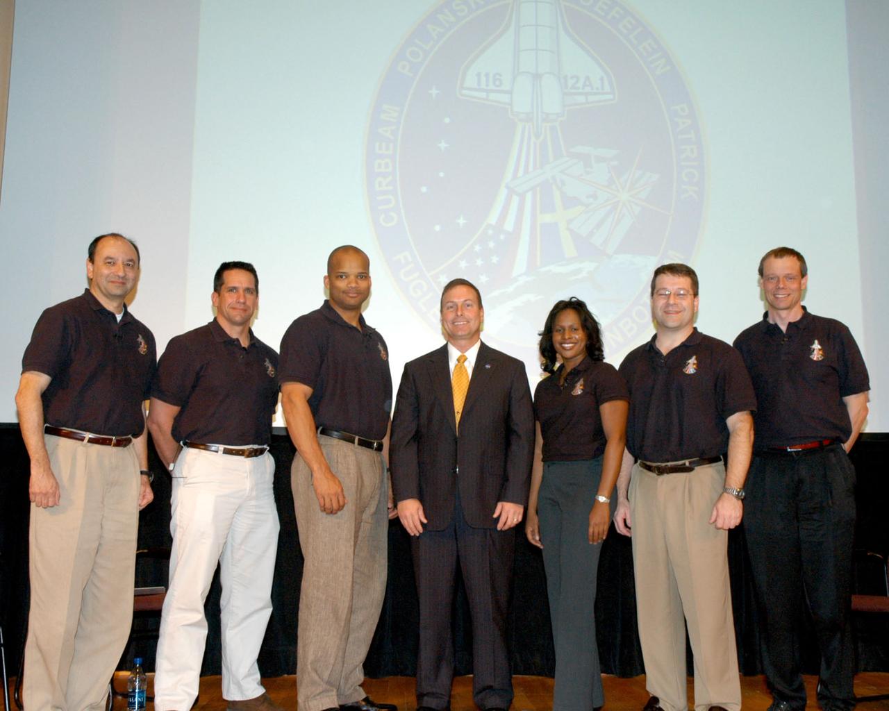 The astronauts of NASA's STS-116 space shuttle mission visited NASA Stennis Space Center in south Mississippi to share highlights of their 13-day mission and to thank SSC employees for the reliability of the space shuttle's main engines, which helped propel Space Shuttle Discovery into orbit during its Dec. 9, 2006, launch. Pictured (from left) are STS-116 crewmembers Commander Mark Polansky, Pilot Bill Oefelein, Mission Specialist Robert Curbeam, SSC Center Director, Richard Gilbrech, Mission Specialists Joan Higginbotham, Nicholas Patrick and Christer Fuglesang. During the mission, which began with the first evening launch since 2002, the astronauts installed the P5 spacer truss segment and rewired the International Space Station's power system.