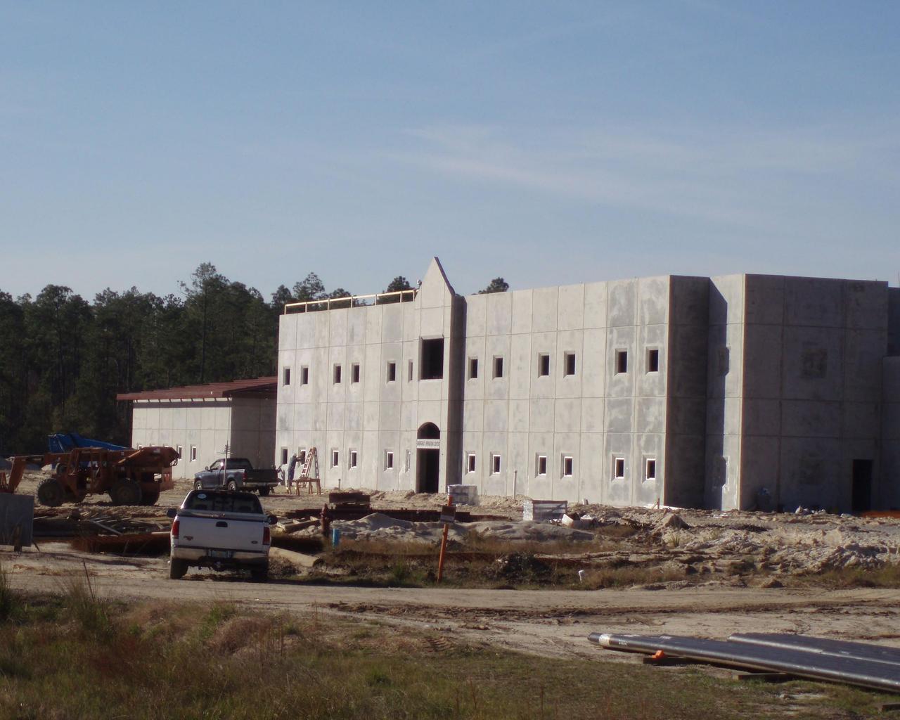Work on Stennis Space Center's new Emergency Operations Center is progressing on schedule, according to Robert Perkins, construction manager with Jacobs Technology. At the turn of the New Year, construction contractors had completed the pervious paving for the north and west parking lots. Part of the facility's `green' design, pervious paving allows water to pass through and be absorbed directly into the ground below, preventing erosion from runoff. Through January, workers concentrated on installing the roof, sprinkler piping and overhead cable trays for electrical and communication lines. The next step will be interior work, erecting wallboard and installing electrical equipment. Perkins said NASA seeks to earn a Silver LEED (Leadership in Energy and Environmental Design) Rating for the project's environmentally-friendly and sustainable design, construction and operation. The facility has a projected completion date of February 2009.