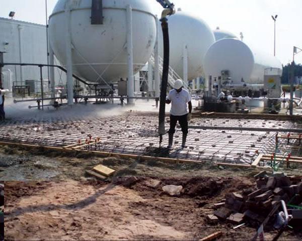 Workers install a bulk diesel storage tank for use at Stennis Space Center. Installation of additional diesel storage tanks is part of the center's hurricane-related risk mitigation work.