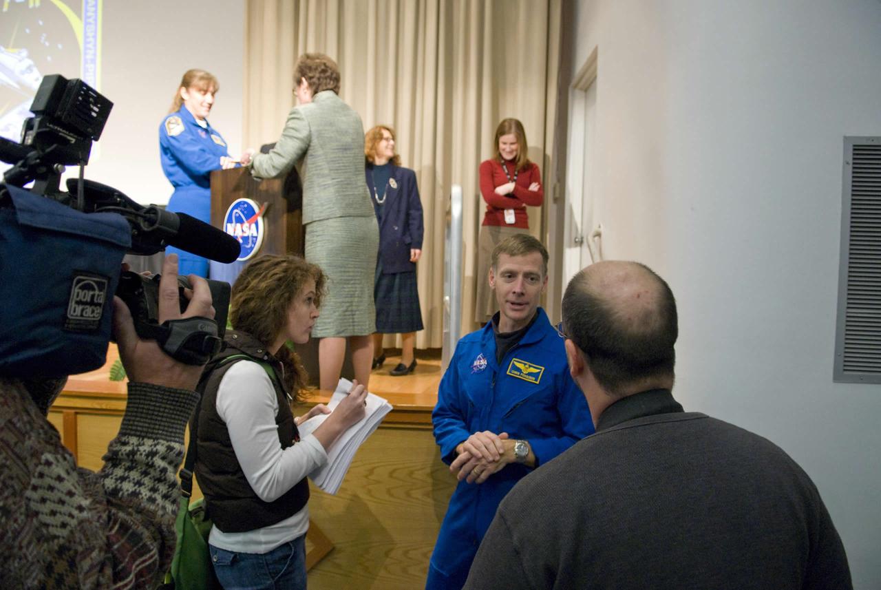 Media members interview Commander Christopher Ferguson (right) during his Jan. 13 visit to StenniSphere. He was joined by Mission Specialist Heidemarie Stefanyshyn-Piper (on stage, left), both members of the STS-126 shuttle mission.