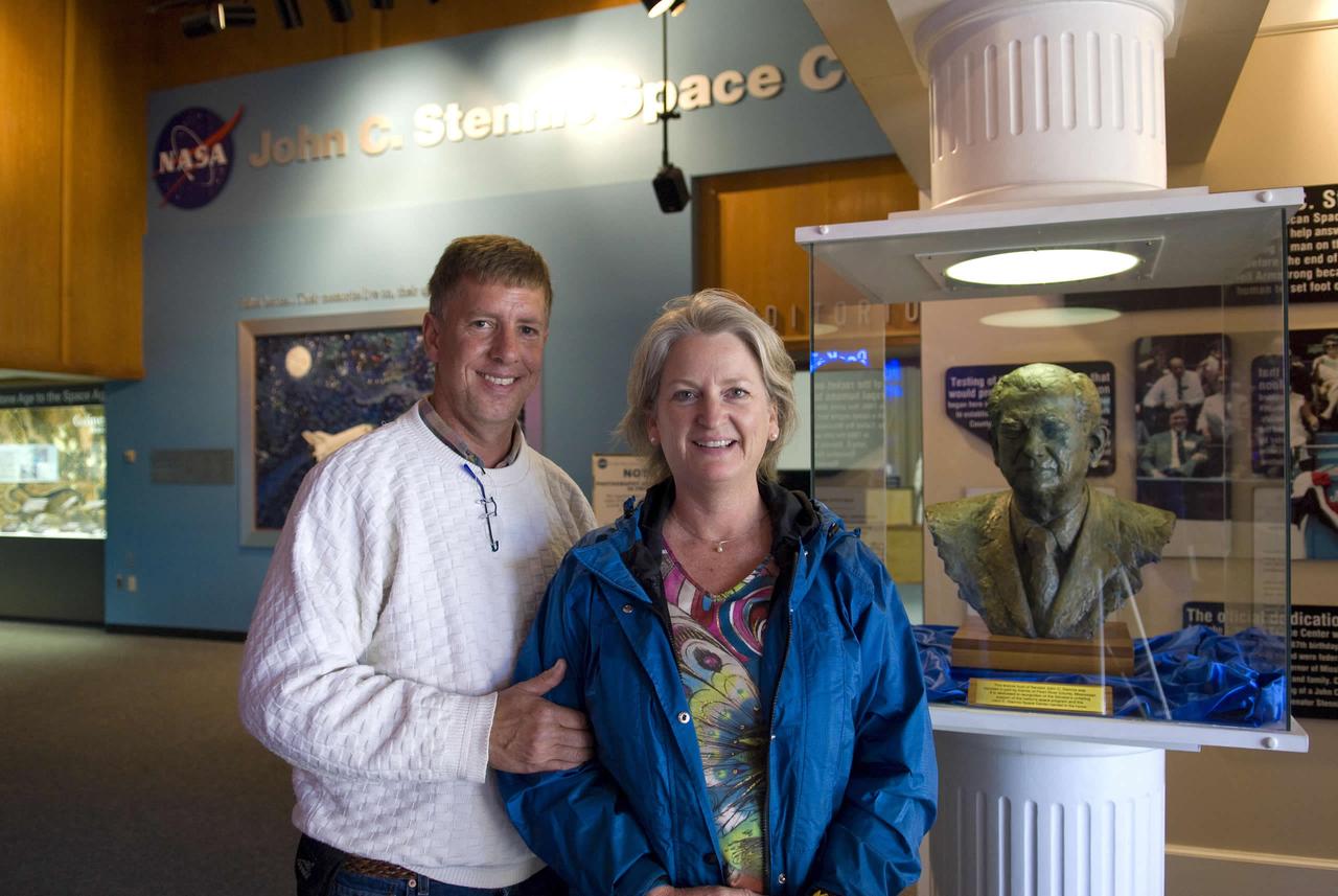 Jane Kenna of Atlanta, granddaughter of the late Sen. John C. Stennis, stands with her husband, John, near a bust of her grandfather displayed in StenniSphere, the visitor center at NASA's John C. Stennis Space Center. Kenna visited Stennis on April 6, her first trip to the rocket engine testing facility since the 1988 ceremony to rename the site in honor of Stennis.