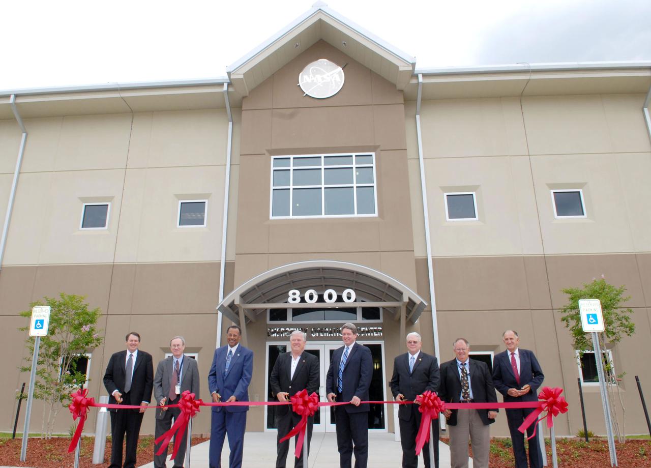 Center Director Gene Goldman and special guests celebrate the opening of the site's new Emergency Operations Center on June 2. Participants included (l t r): Steven Cooper, deputy director of the National Weather Service Southern Region; Tom Luedtke, NASA associate administrator for institutions and management; Charles Scales, NASA associate deputy administrator; Mississippi Gov. Haley Barbour; Gene Goldman, director of Stennis Space Center; Jack Forsythe, NASA assistant administrator for the Office of Security and Program Protection; Dr. Richard Williams, NASA chief health and medical officer; and Weldon Starks, president of Starks Contracting Company Inc. of Biloxi.