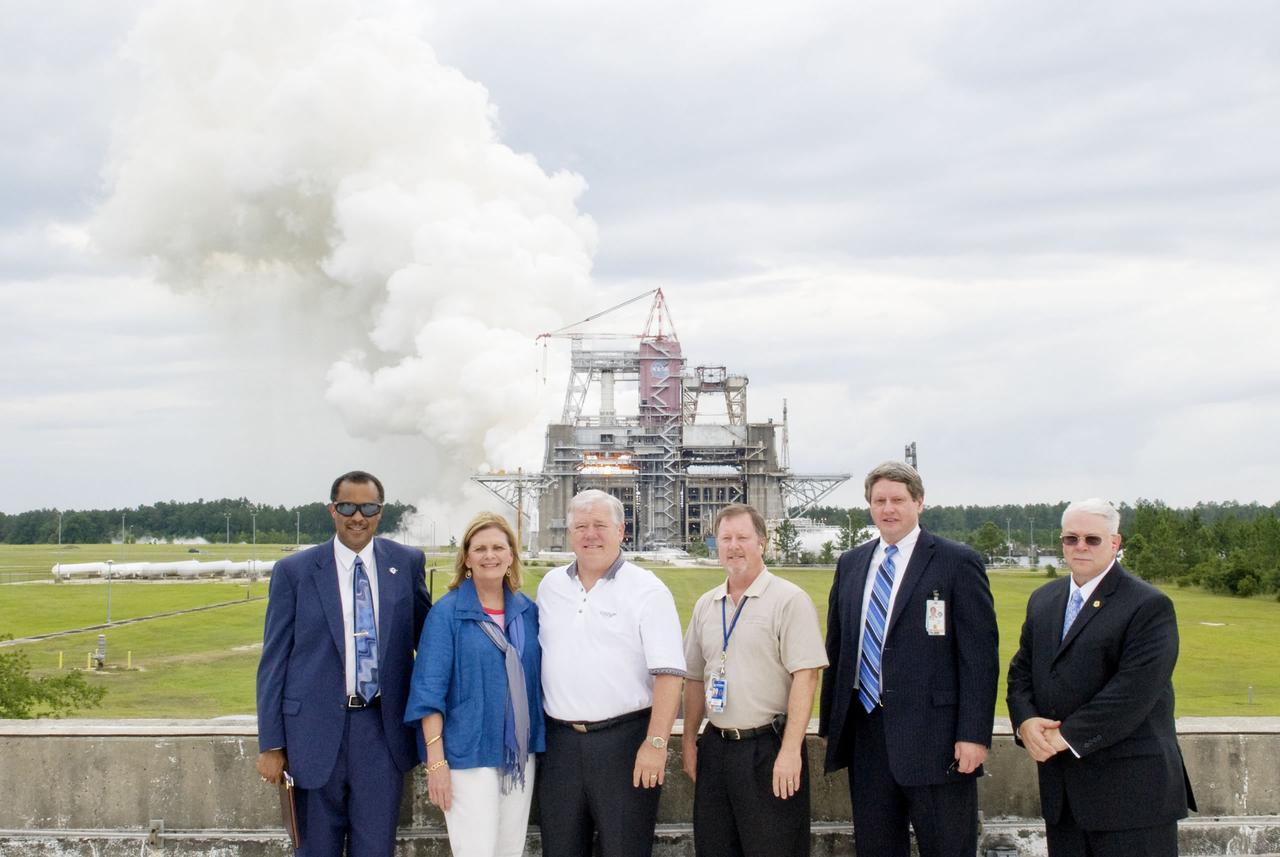 Steam billows from an RS-68 rocket engine test at the B Test Stand at Stennis Space Center on June 2. The test was viewed by Mississippi Gov. Haley Barbour (third from left) and his wife, Marsha, who spent the afternoon at the NASA rocket engine testing center. The governor was joined at the RS-68 test by (l to r) Charles Scales, NASA associate deputy administrator; Jeffrey Wright, Pratt & Whitney Rocketdyne site director at Stennis; Gene Goldman, Stennis director; and Jack Forsythe, NASA assistant administrator for the Office of Security and Program Protection.
