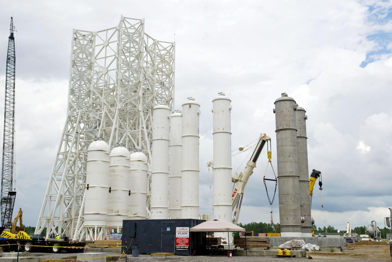 Construction of the A-3 Test Stand approaches another milestone with delivery and installation of water, isopropyl alcohol (IPA) and liquid oxygen (LOX) tanks. The three LOX tanks shown on the left and the two IPA tanks shown on the right are all 35,000 gallons each. The four water tanks in the center are 39,000 gallons each.