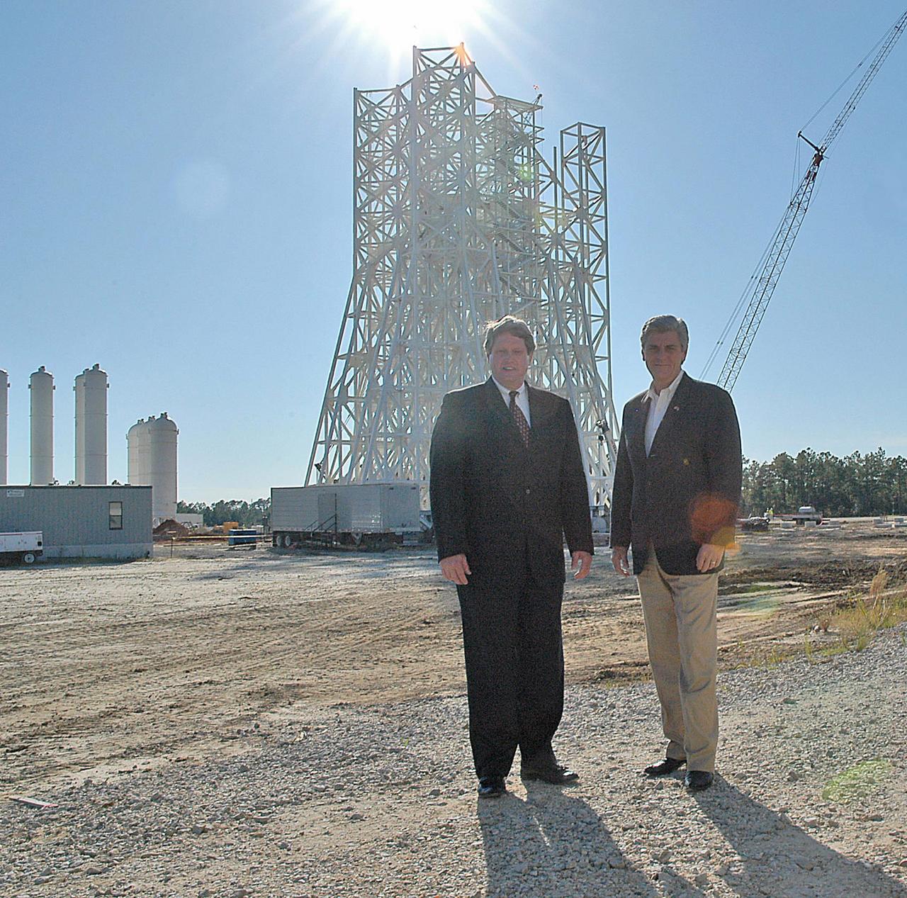 Stennis Space Center Director Gene Goldman (left) stands with Mississippi Lt. Gov. Phil Bryant at the A-3 Test Stand construction site during an Oct. 1 visit by the state official. During his tour, Bryant was updated on construction of the first large test stand at Stennis since the 1960s. The A-3 stand will be used to conduct simulated high-altitude testing on the next generation of rocket engines that will take humans back to the moon and possibly beyond. In addition to touring Stennis facilities, Bryant visited the INFINITY Science Center construction site, where he was updated on work under way to construct a 72,000-square-foot facility that will showcase the science underpinning the missions of NASA and resident agencies at Stennis.
