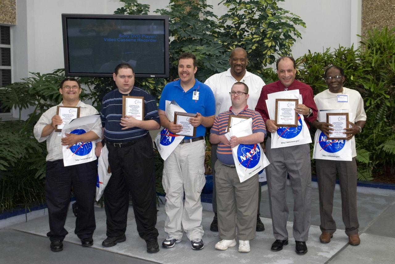 Members of STARC, a non-profit organization in Slidell, La., that seeks to help people with disabilities lead meaningful, productive lives, pose with their appreciation awards during Disability Awareness Day at Stennis Space Center on Oct. 15. The group members received appreciation awards for their dedicated service to the rocket engine testing facility. Disability Awareness Day was hosted by the Stennis Diversity Council and included guest speakers from several area agencies.