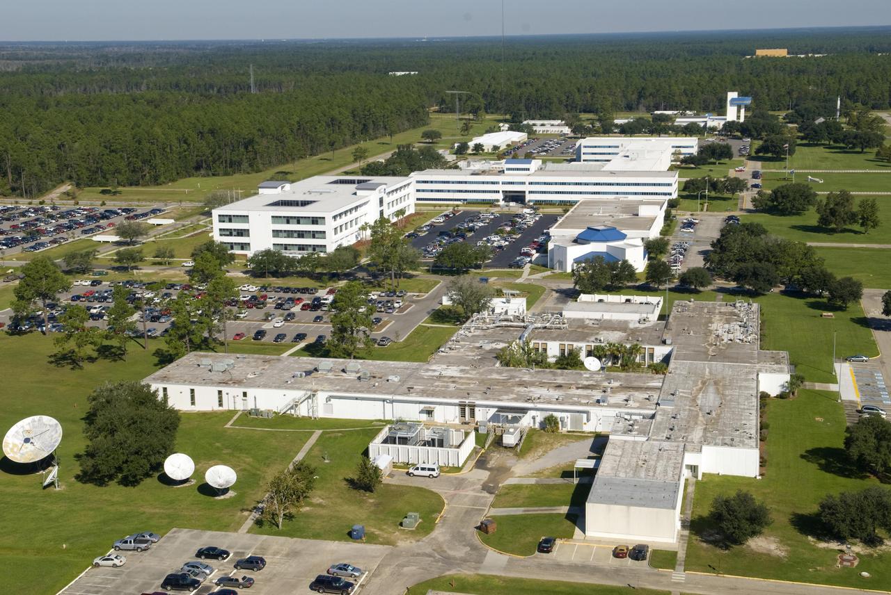 Balch Boulevard at Stennis Space Center features central NASA facilities, including (front to back) Applied Sciences offices, the NASA Shared Services Building, the NASA administration building and the StenniSphere museum and visitor center.