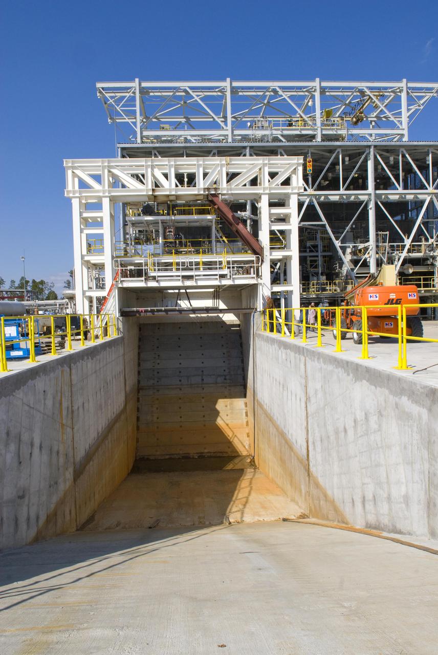 Operators at NASA's John C. Stennis Space Center are completing modifications to the E-1 Test Stand to begin testing Aerojet AJ26 rocket engines in early summer of 2010. Modifications include construction of a 27-foot-deep flame deflector trench. The AJ26 rocket engines will be used to power Orbital Sciences Corp.'s Taurus II space vehicles to provide commercial cargo transportation missions to the International Space Station for NASA. Stennis has partnered with Orbital to test all engines for the transport missions.