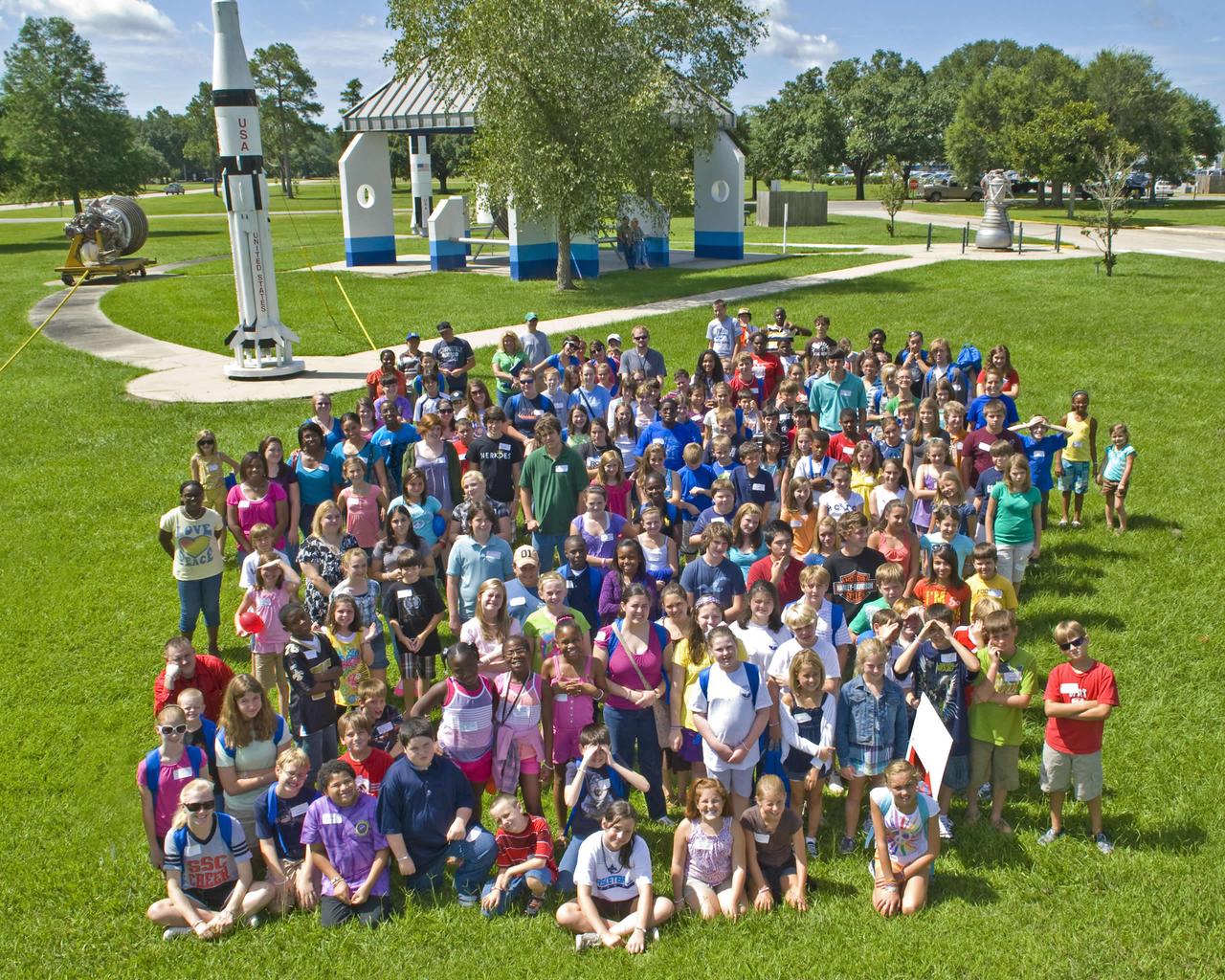 About 200 children of employees at NASA's John C. Stennis Space Center visited the facility for annual Take Our Children to Work activities July 27. Participants enjoyed a windshield tour of the rocket engine test site and various demonstrations and presentations on such topics as cryogenics, the Gulf of Mexico oil spill, computer safety and robotics. They also had an opportunity to take photos at the astronaut suit exhibit and participate in StenniSphere activities.