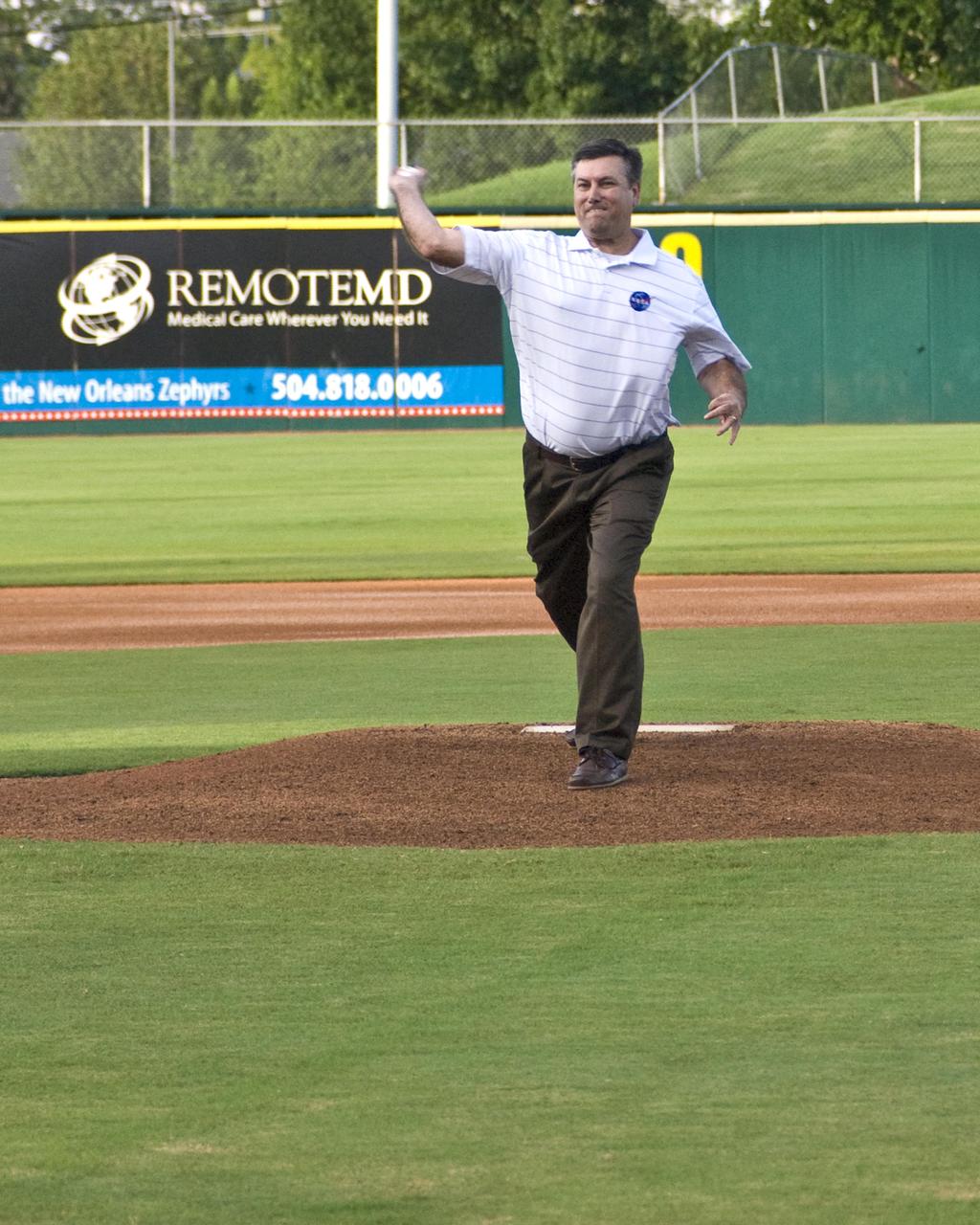 NASA's John C. Stennis Space Center Director Patrick Scheuermann throws the first pitch of the game Aug. 20 at New Orleans Zephyr Field. Stennis employees traveled to New Orleans to host NASA Night at Zephyr Field. Stennis personnel provided a variety of activities and materials for persons attending a game between the New Orleans Zephyrs and the Las Vegas 51s.