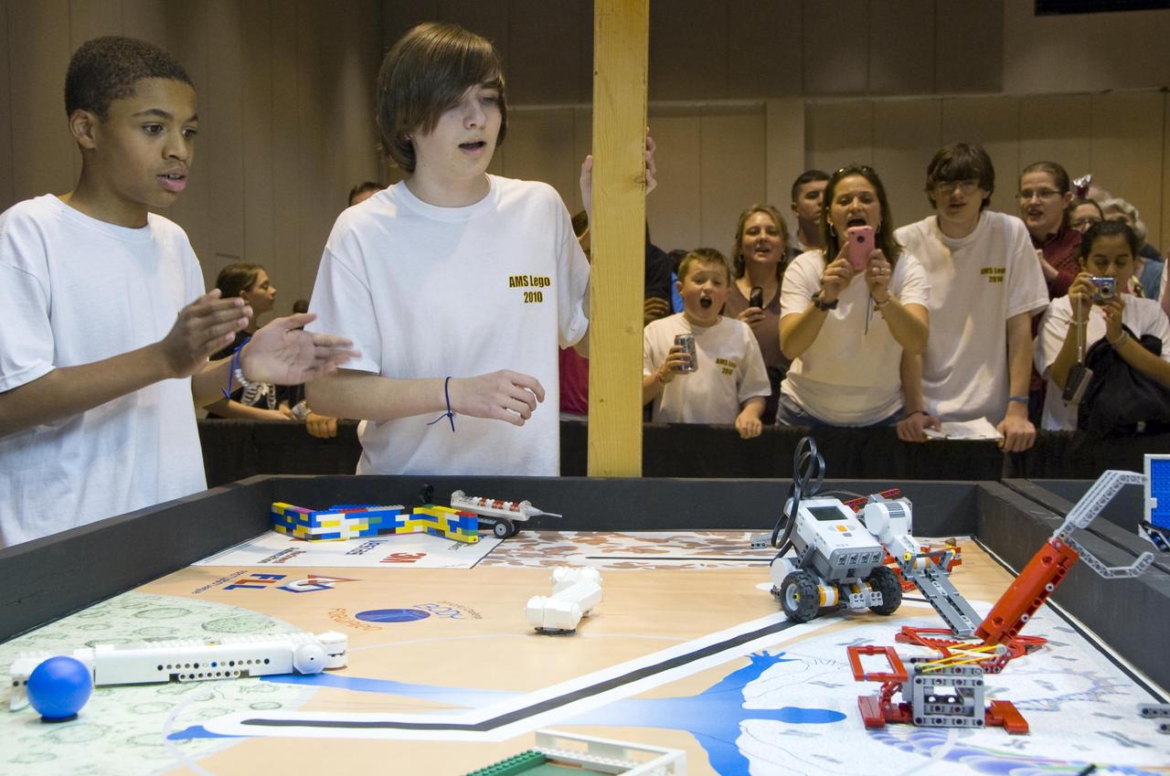 Matthew Myles (left) and Agrippa Kellum from Armstrong Middle School in Starkville, watch as their LEGO robot competes during a Dec. 4 tournament. Elementary and middle school students from across Mississippi gathered in Hattiesburg to participate in the Mississippi Championship FIRST (For Inspiration and Recognition of Science and Technology) LEGO League Tournament. Stennis supports FIRST LEGO League each year by providing mentors, training and tournament volunteers.