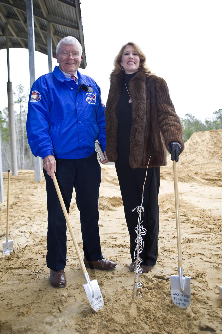 Apollo 13 astronaut Fred Haise stands with Rosemary Roosa, daughter of late Apollo 14 astronaut Stuart Roosa, beside a 'moon tree' planted at the INFINITY science center on Feb. 3, 2011. The moon tree is a descendent of seeds carried into space by Stuart Roosa on the Apollo 14 mission in 1971.