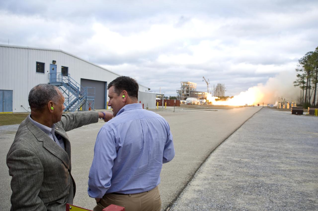 NASA Administrator Charles Bolden (l) and John C. Stennis Space Center Director Patrick Scheuermann watch the successful test of the first Aerojet AJ26 flight engine Feb. 7, 2011. The test was conducted on the E-1 Test Stand at Stennis. The engine now will be sent to Wallops Flight Facility in Virginia, where it will be used to power the first stage of Orbital Sciences Corporation's Taurus II space vehicle. The Feb. 7 test supports NASA's commitment to partner with companies to provide commercial cargo flights to the International Space Station. NASA has partnered with Orbital to carry out the first of eight cargo missions to the space station in early 2012.