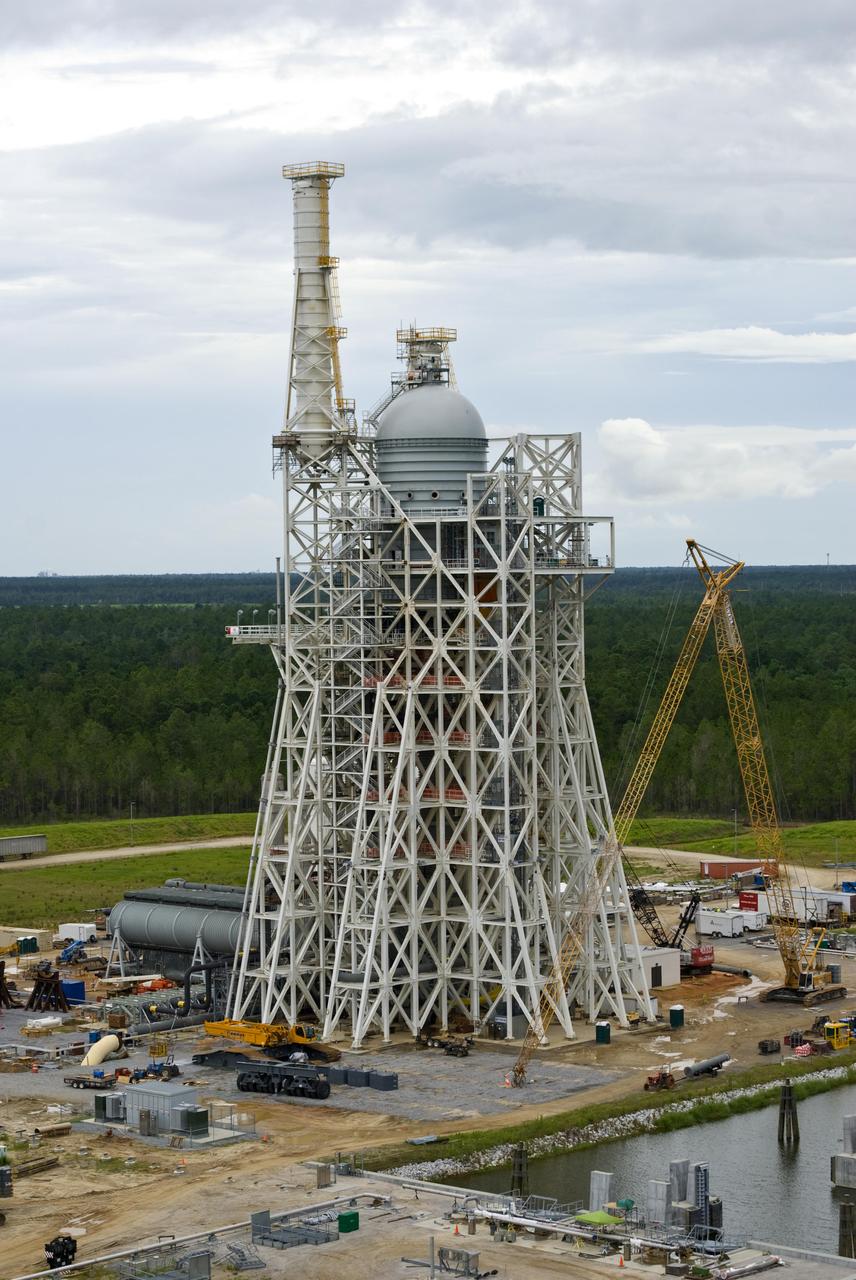 Rocket engine propellant tanks and cell dome top the A-3 Test Stand under construction at Stennis Space Center. The stand will test next-generation rocket engines that could carry humans beyond low-Earth orbit into deep space once more.