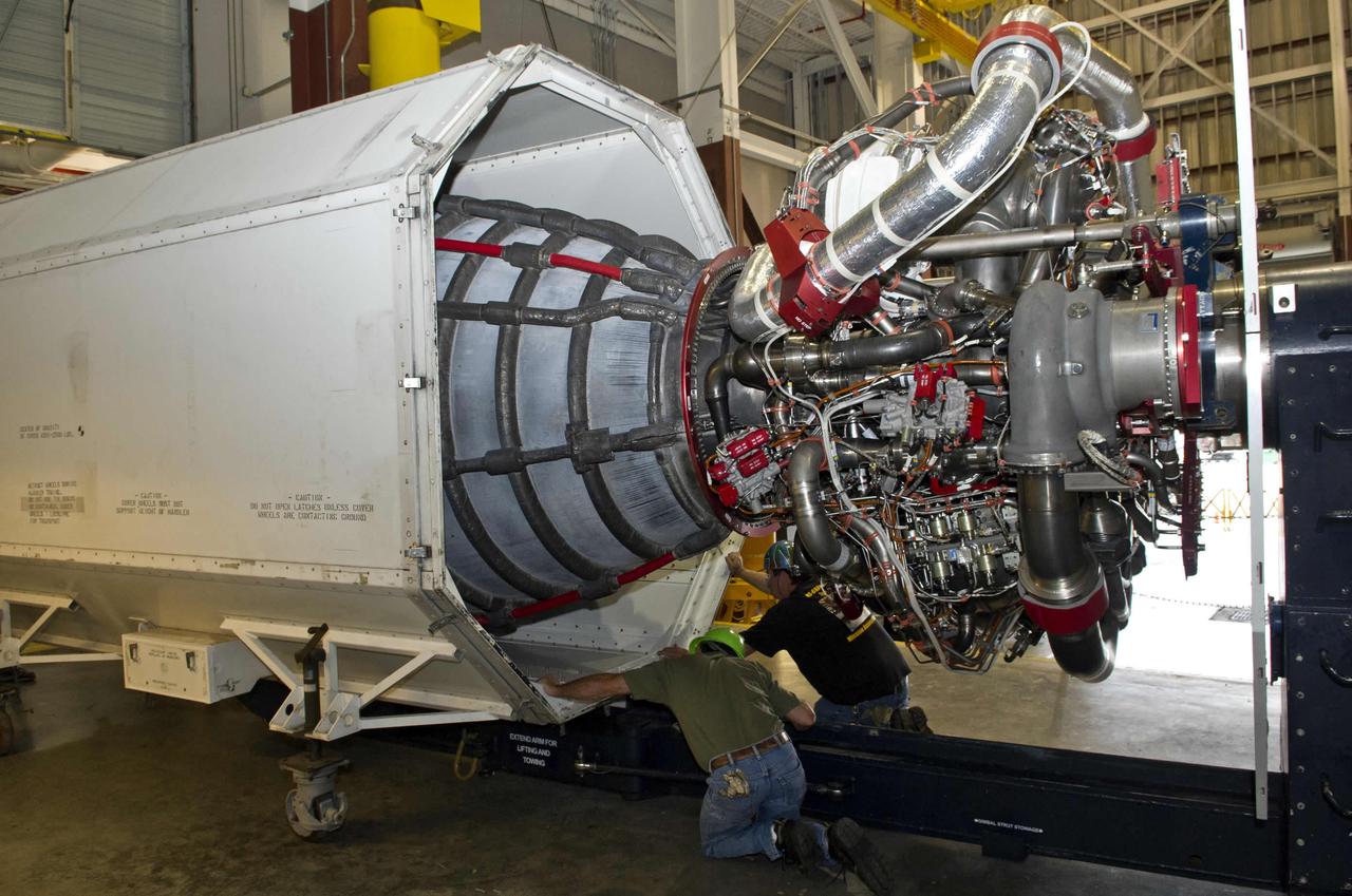 Employees unload a RS25D rocket engine at NASA's John C. Stennis Space Center on Jan. 17. The engine - and 14 others - will be stored at the facility for future testing and use on NASA's new Space Launch System (SLS). The SLS is a new heavy-lift launch vehicle that will expand human presence beyond low-Earth orbit and enable new missions of exploration across the solar system. NASA's Marshall Space Flight Center in Huntsville, Ala., is leading the design and development of the Space Launch System for NASA, including the engine testing program. Delivery of the 15 RS-25 engines will continue throughout the next few months