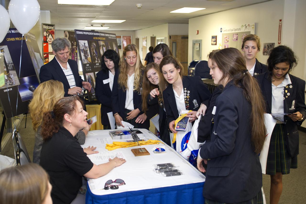 High school students register for activities during a Girls Excited about Math and Science event at Stennis Space Center on March 8, 2012. The event attracted about 130 high school girls and 40 elementary girls from 18 Louisiana and Mississippi for a day of workshop and seminar presentations, a 'Dress for Success' fashion show and a tour of information technology facilities.