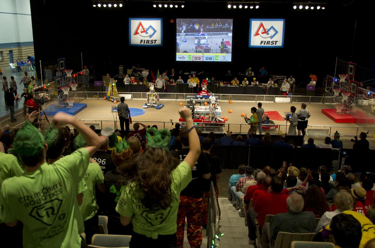 Spectators crew on teams during the 2012 FIRST (For Inspiration and Recognition of Science and Technology) Robotics Bayou Regional Competition March 15-17, 2012, in Kenner, La. Students from 49 high school teams in six states participated in the annual robotics tournament.