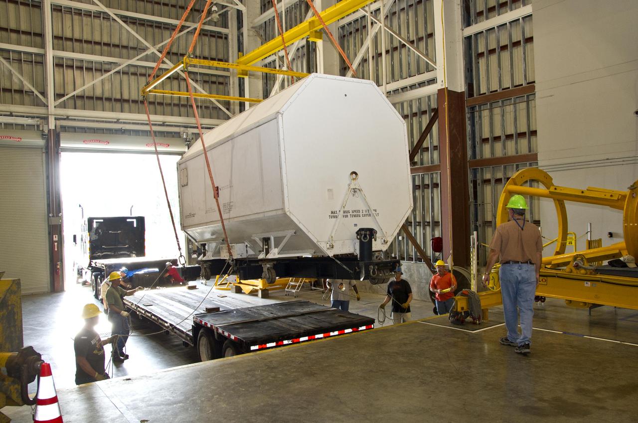 RS-25 series rocket engine No. 2059 is unloaded and positioned at Stennis Space Center on April 10, 2012, for future testing and use on NASA's new Space Launch System. The engine was the last of 15 RS-25 engines to be delivered from NASA's Kennedy Space Center in Florida to Stennis, where all will be stored until testing begins.