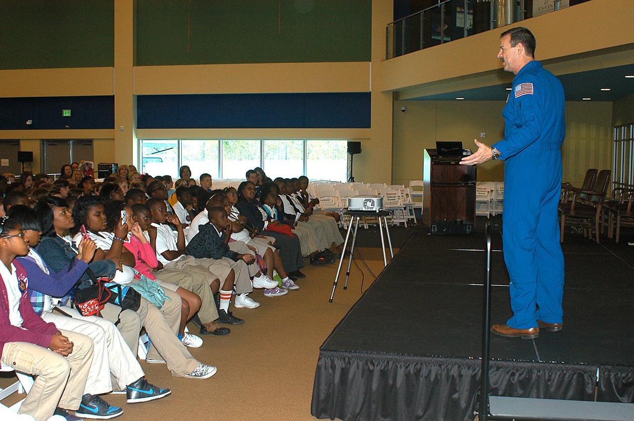 Astronaut Scott Altman speaks to schoolchildren during ribbon-cutting activities for the INFINITY at NASA Stennis Space Center facility April 11, 2012. More than 160 area students attended the ceremony. Following the ceremony, they and other students toured the facility and enjoyed a presentation by Altman about his experiences in space.