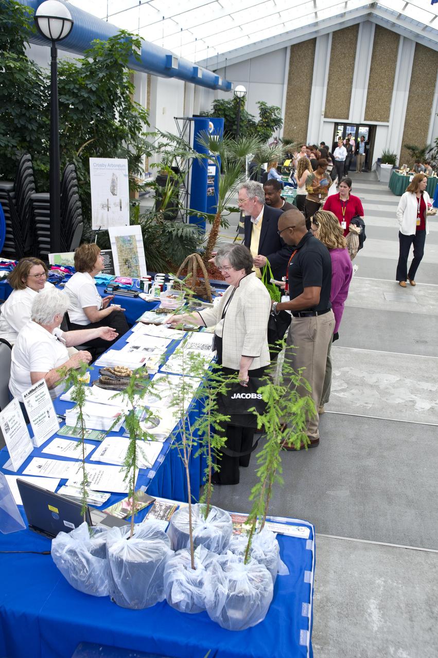 Bonnie Humphrey of NASA (l to r), Van Ward of NASA, Kim Maddox of the Naval Oceanographic Office, and Al Bryden of the NASA Shared Services Center learn about the Crosby Arboretum in Picayune, Miss., during the Earth Day celebration at Stennis Space Center on April 24, 2012.