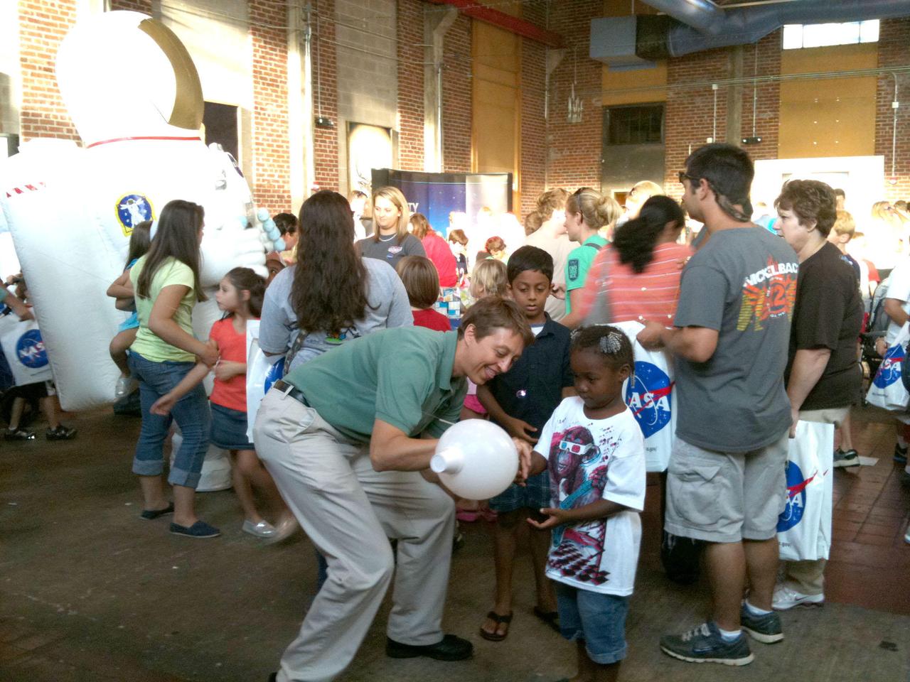 Stennis Space Center visited three Mississippi communities Sept. 11-13, offering interactive and space-related exhibits and presentations to visitors in Grenada, Oxford and Tupelo. During NASA Night activities in Oxford, NASA employee Michele Beisler helped young visitors launch her balloon rocket.