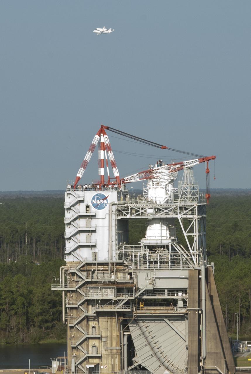 Space shuttle Endeavour made an early-morning flyover Stennis space Center on Sept. 19, en route to Los Angeles, where it will be displayed at the California Science Center. Employees viewed the low-level flyover from various locations, including atop the facility test stands. In this photo, employees watch as the shuttle is ferried above the A-1 Test Stand.