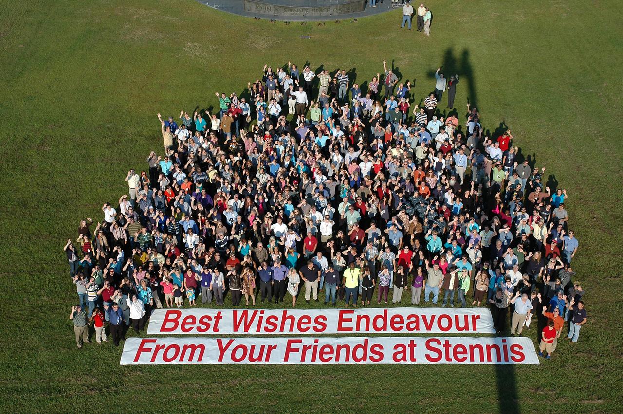 Stennis Space Center employees turned out in force to cheer space shuttle Endeavour as it flew low over the rocket engine test facility early on the morning of Sept. 19. The shuttle is headed to Los Angeles, where it will be on display at the California Science Center. Stennis employees applauded and cheered as the retired shuttle passed low overhead. In addition to those gathered on the lawn in front of the Roy S. Estess Building, many congregated on building rooftops and on facility test stands to view the flyover.