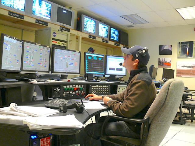 NASA engineer Andy Guymon studies data in the E-3 Test Stand Control Center at John C. Stennis Space Center during testing of NASA's Project Morpheus engine. Nov. 8. The test of the liquid oxygen, liquid methane engine was one of 27 conducted in Stennis' E Test Complex the week of Nov. 5.