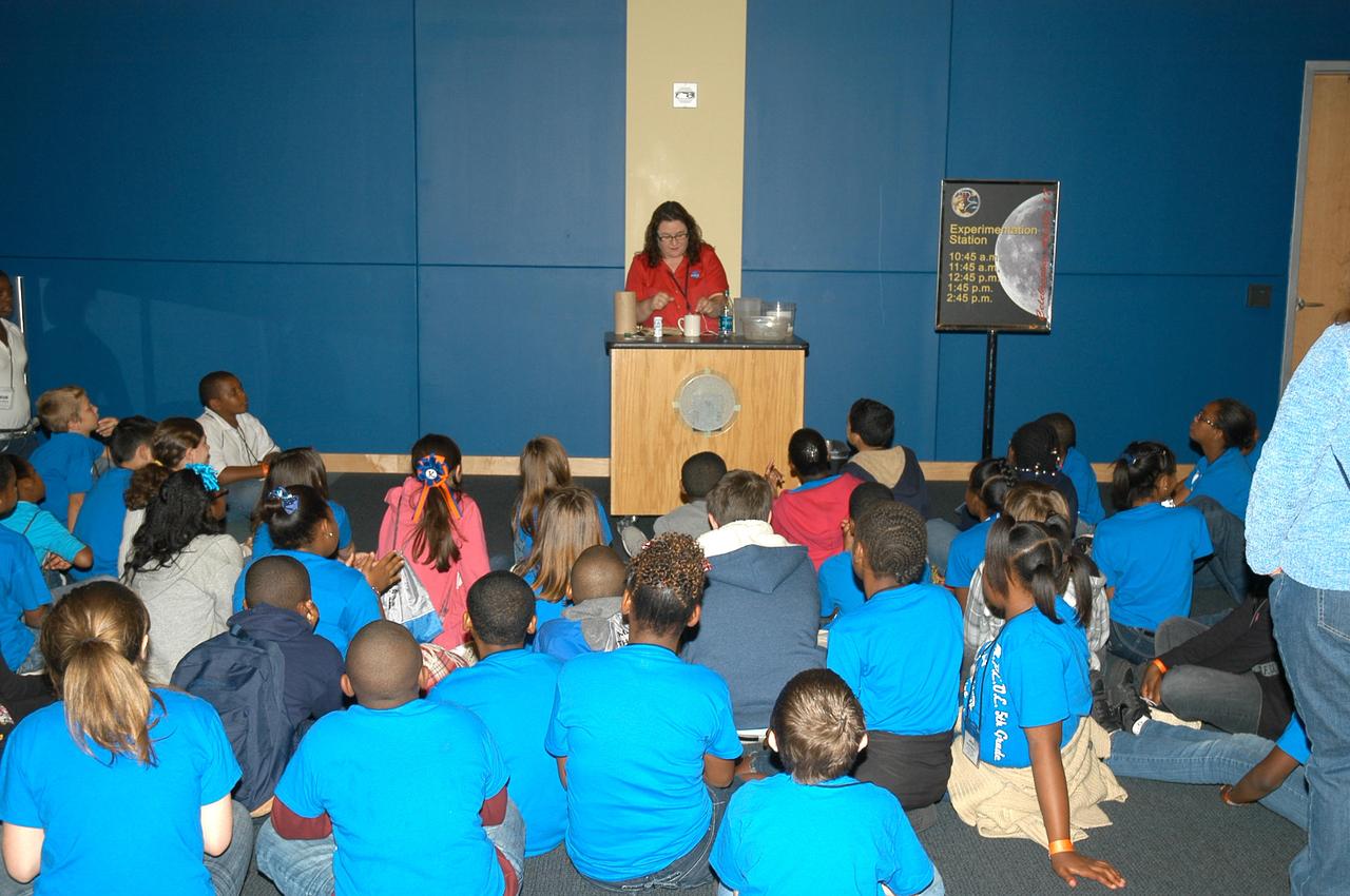 Young visitors to the INFINITY Science Center, a NASA visitors center, on Dec. 7 enjoy a Living and Working in Space presentation during activities celebrating the Apollo 17 lunar mission in 1972. Visitors were able to learn about the historic mission and to participate in hands-on activities. Apollo 17 was the final mission of America's manned lunar effort.