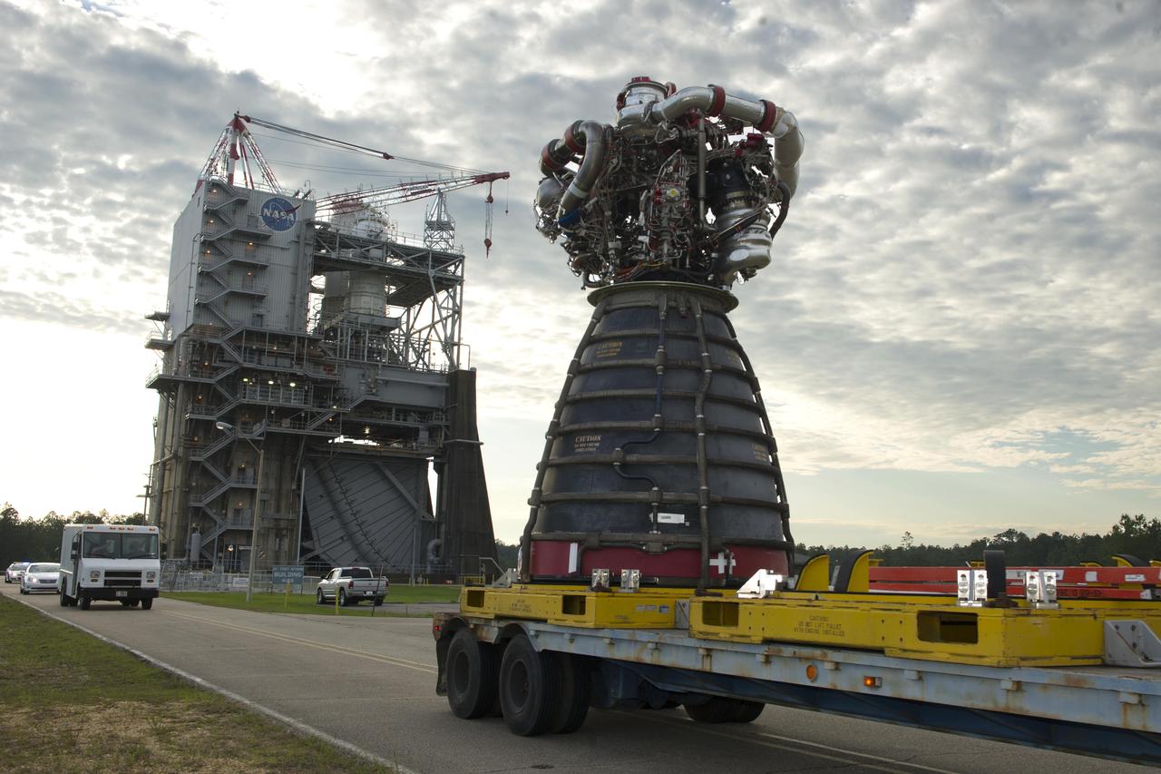 RS-25 rocket engine No. 2059 is removed from the A-1 Test Stand at Stennis Space Center on May 19, 2016. The engine was tested March 10 on the stand and is ready for use on NASA’s new Space Launch System (SLS) vehicle. NASA is developing the SLS to carry humans deeper into space than ever before. The SLS core stage will be powered by four RS-25 engines. Engine No. 2059 is scheduled for use on the first crewed SLS mission, Exploration Mission-2, which will carry American astronauts beyond low-Earth orbit for the first time since 1972. The photo above shows the engine, as well as the yellow thrust frame adapter above it, which holds the engine in place for testing.