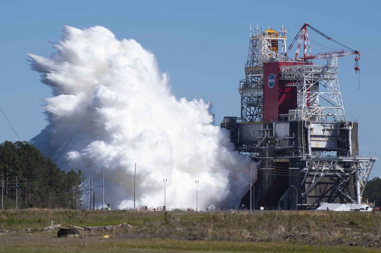 NASA conducts a hot fire test March 18, 2021, of the core stage for the agency’s Space Launch System rocket on the B-2 Test Stand at Stennis Space Center near Bay St. Louis, Mississippi. The hot fire test of the stage’s four RS-25 engines generated a combined 1.6 million pounds of thrust, just as will occur during an actual launch. The hot fire is the final test of the Green Run test series, which represents a comprehensive assessment of the core stage and its integrated systems prior to its launch on the Artemis I mission to the Moon.