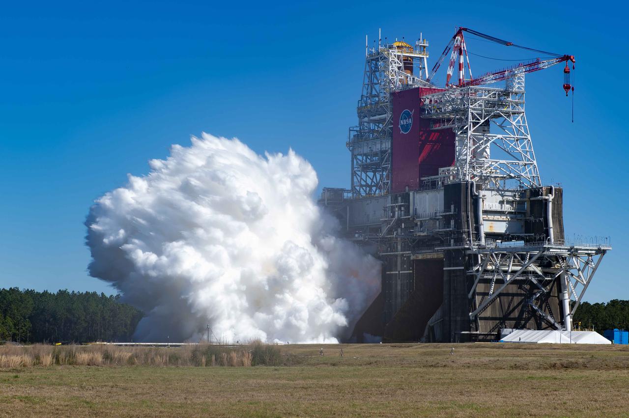 NASA conducts a hot fire test March 18, 2021, of the core stage for the agency’s Space Launch System rocket on the B-2 Test Stand at Stennis Space Center near Bay St. Louis, Mississippi. The hot fire test of the stage’s four RS-25 engines generated a combined 1.6 million pounds of thrust, just as will occur during an actual launch. The hot fire is the final test of the Green Run test series, which represents a comprehensive assessment of the core stage and its integrated systems prior to its launch on the Artemis I mission to the Moon.