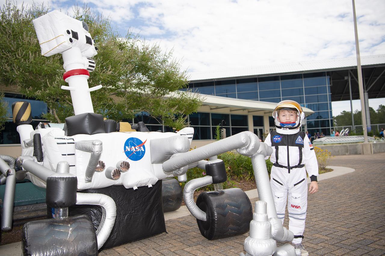 Jackson Barber of Mandeville, LA, poses in front of an inflatable Mars Rover outside INFINITY Science Center adjacent to NASA’s Stennis Space Center. The science center held its grand reopening on May 29, 2021, after closing in 2020 due to Covid 19.