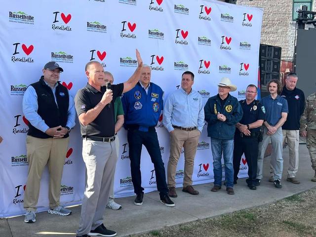 NASA Stennis Acting Center Director John Bailey, front left, speaks to people gathered to view the total solar eclipse in Russellville, Arkansas, on April 8.