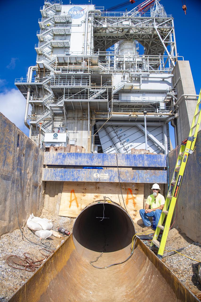 : An image shows the entry location of the existing carrier pipe where new liner sections are being placed at the base of the Fred Haise Test Stand at NASA’s Stennis Space Center in the last phase of updating the original test complex industrial water system.