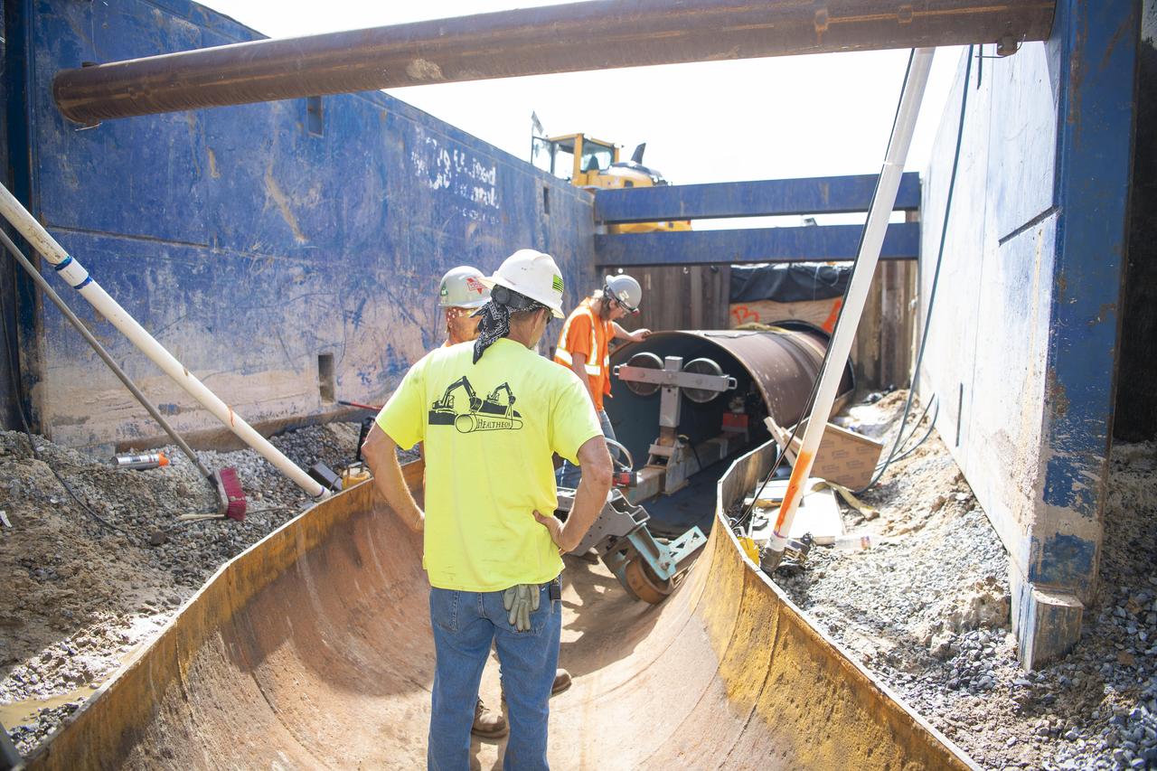 Crews use a special tool to place a new pipeline liner inside the existing carrier pipe near the Fred Haise Test Stand on May 1 in the last phase of updating the original test complex industrial water system at NASA’s Stennis Space Center.
